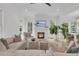 Beautiful open-concept living room featuring a fireplace, contemporary furniture, and ample natural light at 300 Ginned Cotton St, Charleston, SC 29492