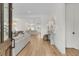 Bright, open-concept space featuring a modern kitchen and dining area with contemporary light fixtures at 300 Ginned Cotton St, Charleston, SC 29492