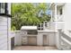 Well-equipped outdoor kitchen featuring stainless steel grill, drawers and cabinets for convenient outdoor cooking at 300 Ginned Cotton St, Charleston, SC 29492