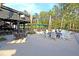 Spacious outdoor seating area with fire pit and rocking chairs for relaxing and socializing at 300 Ginned Cotton St, Charleston, SC 29492
