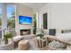 Outdoor patio area complete with stone fireplace, TV, comfortable seating and outdoor living space at 300 Ginned Cotton St, Charleston, SC 29492