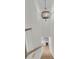 Bright staircase leading down to a beverage bar with light wood floors and white railings at 300 Ginned Cotton St, Charleston, SC 29492