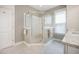 Bathroom featuring a glass enclosed shower with tiled surround and granite counter at 3006 Cross Vine Ln, Summerville, SC 29483