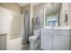 Bright bathroom features a tub, toilet, vanity, and mirror at 3006 Cross Vine Ln, Summerville, SC 29483