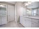 Bathroom featuring a white vanity with granite countertop and double mirrors at 3006 Cross Vine Ln, Summerville, SC 29483