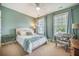 Comfortable bedroom with a ceiling fan, two windows, and soothing blue walls at 3006 Cross Vine Ln, Summerville, SC 29483