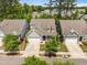 Charming home with a two-car garage, manicured lawn, complemented by mature trees and a welcoming front porch at 3006 Cross Vine Ln, Summerville, SC 29483