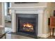 Cozy fireplace with a white mantel in a neutrally decorated living space at 3006 Cross Vine Ln, Summerville, SC 29483