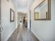 Elegant foyer with hardwood floors, tray ceiling, and sophisticated decor at 3006 Cross Vine Ln, Summerville, SC 29483