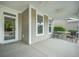 Inviting front porch with a ceiling fan and comfortable seating, perfect for relaxing outdoors at 3006 Cross Vine Ln, Summerville, SC 29483