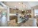 Spacious kitchen with granite countertops, a large island, stainless steel appliances, and ample cabinet space at 3006 Cross Vine Ln, Summerville, SC 29483