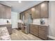 Modern kitchen with stainless steel refrigerator, gray cabinets, and granite countertops at 3006 Cross Vine Ln, Summerville, SC 29483