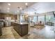 Spacious kitchen with stainless steel appliances opens to a dining and living area at 3006 Cross Vine Ln, Summerville, SC 29483