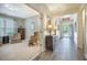 Stylish living room with comfortable seating, and seamlessly connected to the foyer at 3006 Cross Vine Ln, Summerville, SC 29483