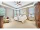 Spacious main bedroom with tray ceiling, neutral tones, and large windows at 3006 Cross Vine Ln, Summerville, SC 29483