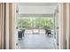An interior view of a screened-in porch overlooking a backyard at 3006 Cross Vine Ln, Summerville, SC 29483