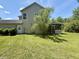 Spacious backyard with green lawn and screened in porch; the ideal space for outdoor living and entertaining at 319 Parish Park, Summerville, SC 29485