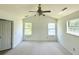 Bedroom with neutral carpet, ceiling fan, large closet and two windows for lots of natural light at 319 Parish Park, Summerville, SC 29485