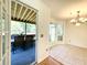 Bright dining area with tile floors and access to a screened porch offers ample space for entertaining and relaxation at 319 Parish Park, Summerville, SC 29485