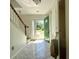 Bright foyer with marble floors and an open door, a staircase, and an opening to a bathroom at 319 Parish Park, Summerville, SC 29485