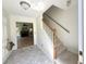 Bright foyer with marble floors, a staircase, and an opening to a spacious living room with a fireplace at 319 Parish Park, Summerville, SC 29485