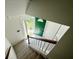 View from the top of the stairs down into the foyer, featuring a bright green front door at 319 Parish Park, Summerville, SC 29485