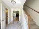 Bright foyer with marble floors, a staircase, and an opening to a spacious living room with a fireplace at 319 Parish Park, Summerville, SC 29485
