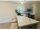 Bright kitchen features white counters, stainless appliances, gray cabinets and a breakfast bar with seating at 319 Parish Park, Summerville, SC 29485