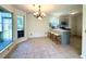 Eat-in kitchen boasts an island with bar seating, modern appliances, and a view of the backyard at 319 Parish Park, Summerville, SC 29485
