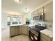 Well-equipped kitchen features stainless appliances and modern finishes, open to the breakfast nook and living space at 319 Parish Park, Summerville, SC 29485
