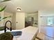 Modern kitchen features stainless steel appliances, white counters, and seating at the breakfast bar at 319 Parish Park, Summerville, SC 29485