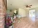 Bright living room with hardwood floors, brick fireplace, and open floor plan offers comfortable living at 319 Parish Park, Summerville, SC 29485