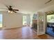 Inviting living room with hardwood floors, brick fireplace, and screened porch access, offers a cozy living space at 319 Parish Park, Summerville, SC 29485
