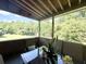Enjoy serene outdoor living on this screened porch with backyard views of mature trees and beautiful foliage at 319 Parish Park, Summerville, SC 29485