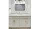Bathroom featuring a modern vanity with framed mirror and custom cabinets at 32 Elmora Ave, Goose Creek, SC 29445