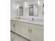 Bathroom featuring double sink vanity with modern fixtures and stylish mirrors with lighting at 32 Elmora Ave, Goose Creek, SC 29445