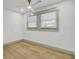 Bright bedroom features hardwood floors, recessed lighting, and light neutral walls at 32 Elmora Ave, Goose Creek, SC 29445