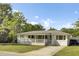 Cozy one-story home with a charming front porch and a well-kept yard at 32 Elmora Ave, Goose Creek, SC 29445