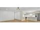 Open floorplan with wood floors, kitchen, and stainless steel appliances create a modern space at 32 Elmora Ave, Goose Creek, SC 29445