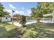 Inviting backyard pool area featuring lovely landscaping and a secure privacy fence at 32 Elmora Ave, Goose Creek, SC 29445