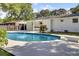 Backyard pool with diving board surrounded by lush landscaping at 32 Elmora Ave, Goose Creek, SC 29445