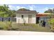 Backyard shed with a neutral door, offering additional storage and practicality at 32 Elmora Ave, Goose Creek, SC 29445