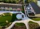 Aerial view of a complex featuring manicured lawns and paved walkways, and colorful townhouses at 330 Concord St # Th17, Charleston, SC 29401
