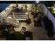Nighttime view of an outdoor patio with cozy seating, beautiful landscaping, and a dining table under an umbrella at 330 Concord St # Th17, Charleston, SC 29401