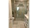 Modern bathroom featuring a glass shower, tiled flooring, and contemporary fixtures at 330 Concord St # Th17, Charleston, SC 29401