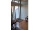 Hallway with hardwood flooring, decor accents, and access to outdoor patio at 330 Concord St # Th17, Charleston, SC 29401