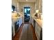 Contemporary kitchen with white cabinets, modern appliances, and wood floors at 330 Concord St # Th17, Charleston, SC 29401