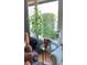 Cozy living room with a large window and view of the lush backyard at 330 Concord St # Th17, Charleston, SC 29401