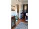 Living room featuring hardwood floors, a chair, and views of the kitchen at 330 Concord St # Th17, Charleston, SC 29401