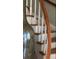 Beautiful staircase with curved wood railing and white spindles at 330 Concord St # Th17, Charleston, SC 29401